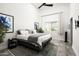 Bright bedroom featuring a cozy bed, modern fan, and stylish decor at 7100 N 47Th St, Paradise Valley, AZ 85253