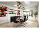 Dining room boasts a modern glass table set, stylish lighting, and colorful artwork at 7100 N 47Th St, Paradise Valley, AZ 85253
