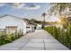 Contemporary home with long driveway, mountain views, and bright landscaping at 7100 N 47Th St, Paradise Valley, AZ 85253