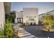Inviting front yard with modern landscaping, a walkway, and well-maintained greenery, creating curb appeal at 7100 N 47Th St, Paradise Valley, AZ 85253