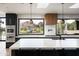 Gourmet kitchen featuring a spacious island, stylish pendant lighting, and a scenic window view at 7100 N 47Th St, Paradise Valley, AZ 85253