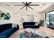 Bright living room features hardwood floors, modern decor, and an open layout to the primary bedroom at 7100 N 47Th St, Paradise Valley, AZ 85253