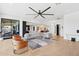 Spacious living room showcasing the open-concept layout, modern furniture, and seamless flow to other areas at 7100 N 47Th St, Paradise Valley, AZ 85253