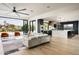 Open-concept living space with a seamless flow from the living area to the modern kitchen and outdoor views at 7100 N 47Th St, Paradise Valley, AZ 85253