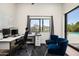 Bright office space with a view of the pool, a desk, and comfortable seating at 7100 N 47Th St, Paradise Valley, AZ 85253