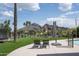 Relaxing poolside view with chairs, umbrella, and scenic mountain backdrop at 7100 N 47Th St, Paradise Valley, AZ 85253