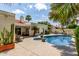 Backyard featuring a pool area with lounge chairs and lush landscaping at 7354 E San Miguel Ave, Scottsdale, AZ 85250