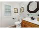 Bathroom featuring updated fixtures, framed art, and a white sink basin at 7354 E San Miguel Ave, Scottsdale, AZ 85250