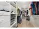 Organized walk-in closet with shelving, drawers, and hanging space for clothing and accessories at 7354 E San Miguel Ave, Scottsdale, AZ 85250