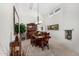 Open dining room with vaulted ceilings, lots of natural light, and dining set for eight at 7354 E San Miguel Ave, Scottsdale, AZ 85250