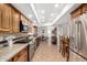 Spacious kitchen with wood cabinets, granite countertops, tile floors, and modern stainless steel appliances at 7354 E San Miguel Ave, Scottsdale, AZ 85250