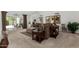Spacious living room with plush carpeting, comfortable seating, and a sliding glass door leading to the outdoor space at 7354 E San Miguel Ave, Scottsdale, AZ 85250