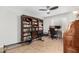 Office space featuring bookshelves and an area for exercise equipment at 7354 E San Miguel Ave, Scottsdale, AZ 85250