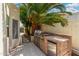 Built-in outdoor kitchen with stainless steel grill and brick accents, great for outdoor cooking at 7354 E San Miguel Ave, Scottsdale, AZ 85250