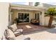 Covered patio with seating, a ceiling fan, and view of a pool at 7354 E San Miguel Ave, Scottsdale, AZ 85250
