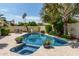 Inviting backyard pool and spa surrounded by desert landscaping, providing a tranquil outdoor retreat at 7354 E San Miguel Ave, Scottsdale, AZ 85250