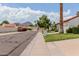 Charming street view showcasing well-maintained homes and picturesque landscaping with mountain views at 7354 E San Miguel Ave, Scottsdale, AZ 85250