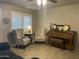 Cozy living room with a piano, perfect for relaxation and entertaining guests at 742 S Los Alamos --, Mesa, AZ 85204