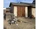 Outdoor shed with double doors, ideal for storage and yard tools at 742 S Los Alamos --, Mesa, AZ 85204