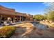 Expansive backyard with pool, spa, outdoor kitchen, and lounge area, showcasing the home's seamless indoor-outdoor living design at 7547 E Mary Sharon Dr, Scottsdale, AZ 85266