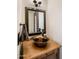Unique bathroom featuring a vessel sink, custom wood cabinet, and stylish fixtures at 7547 E Mary Sharon Dr, Scottsdale, AZ 85266