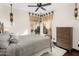 Bedroom with decorative window coverings, ceiling fan, and comfortable bed at 7547 E Mary Sharon Dr, Scottsdale, AZ 85266