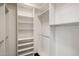 Walk-in closet featuring custom shelving and ample storage space at 7547 E Mary Sharon Dr, Scottsdale, AZ 85266