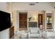 Inviting foyer with beautiful wood door, decorative accents, and marble floors, seamlessly transitioning into the living space at 7547 E Mary Sharon Dr, Scottsdale, AZ 85266