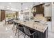 Bright, modern kitchen with a large center island, granite countertops, stainless steel appliances, and stylish pendant lighting at 7547 E Mary Sharon Dr, Scottsdale, AZ 85266
