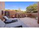 Charming outdoor patio with chaise lounges and a landscaped garden area at 7547 E Mary Sharon Dr, Scottsdale, AZ 85266