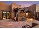 Charming courtyard featuring a fireplace, covered porch, and views into the home's living area at 7547 E Mary Sharon Dr, Scottsdale, AZ 85266