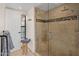 Modern shower room with glass door, tile walls, and dual shower heads at 7547 E Mary Sharon Dr, Scottsdale, AZ 85266