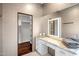 Vanity area featuring a lighted mirror and built-in dressing table at 7547 E Mary Sharon Dr, Scottsdale, AZ 85266