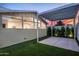 Backyard patio area with a pergola, artificial grass, and vibrant sunset views at 7646 E Catalina Dr, Scottsdale, AZ 85251