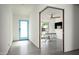 Modern foyer with a blue front door leading to an office area and other parts of the home at 7646 E Catalina Dr, Scottsdale, AZ 85251