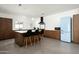 Bright, open kitchen with a blue SMEG refrigerator, wood cabinets, and a kitchen island with bar stools at 7646 E Catalina Dr, Scottsdale, AZ 85251