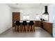Bright, open kitchen with a blue SMEG refrigerator, wood cabinets, and a kitchen island with seating at 7646 E Catalina Dr, Scottsdale, AZ 85251