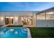 Inviting backyard pool with expansive sliding glass doors creating seamless indoor/outdoor living at 7646 E Catalina Dr, Scottsdale, AZ 85251