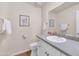 Half bathroom with modern sink, mirror, decor, and fixtures at 7684 E Minnezona Ave, Scottsdale, AZ 85251