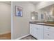 Bathroom with neutral walls, a single sink, and vanity with white cabinets at 7684 E Minnezona Ave, Scottsdale, AZ 85251