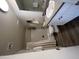 A clean bathroom features a shower-tub combo with curtain, toilet, vanity with sink, and decorative mirror at 7684 E Minnezona Ave, Scottsdale, AZ 85251