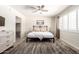 Comfortable bedroom featuring a ceiling fan, and soft natural light at 7684 E Minnezona Ave, Scottsdale, AZ 85251