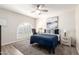 Cozy bedroom with a full bed, shuttered windows, and soft carpet flooring at 7684 E Minnezona Ave, Scottsdale, AZ 85251