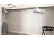 Walk-in closet with ample storage space and an ironing board at 7684 E Minnezona Ave, Scottsdale, AZ 85251