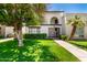 Charming two-story condo featuring a gated entry, balcony, and lush landscaping at 7684 E Minnezona Ave, Scottsdale, AZ 85251