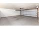 Spacious garage with a freshly painted concrete floor at 7684 E Minnezona Ave, Scottsdale, AZ 85251