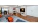 Open-concept living area featuring stylish decor, tile floors, and a comfortable sectional seating area at 7684 E Minnezona Ave, Scottsdale, AZ 85251