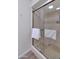 Bathroom shower with glass doors and shower head at 7684 E Minnezona Ave, Scottsdale, AZ 85251