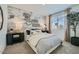Comfortable bedroom showcases a decorative wall, soft lighting, and a serene ambiance at 8035 E Paloma Ave, Mesa, AZ 85212