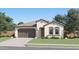 Charming single-story home with a two-car garage, neutral stucco, and beautiful desert landscaping at 8035 E Paloma Ave, Mesa, AZ 85212